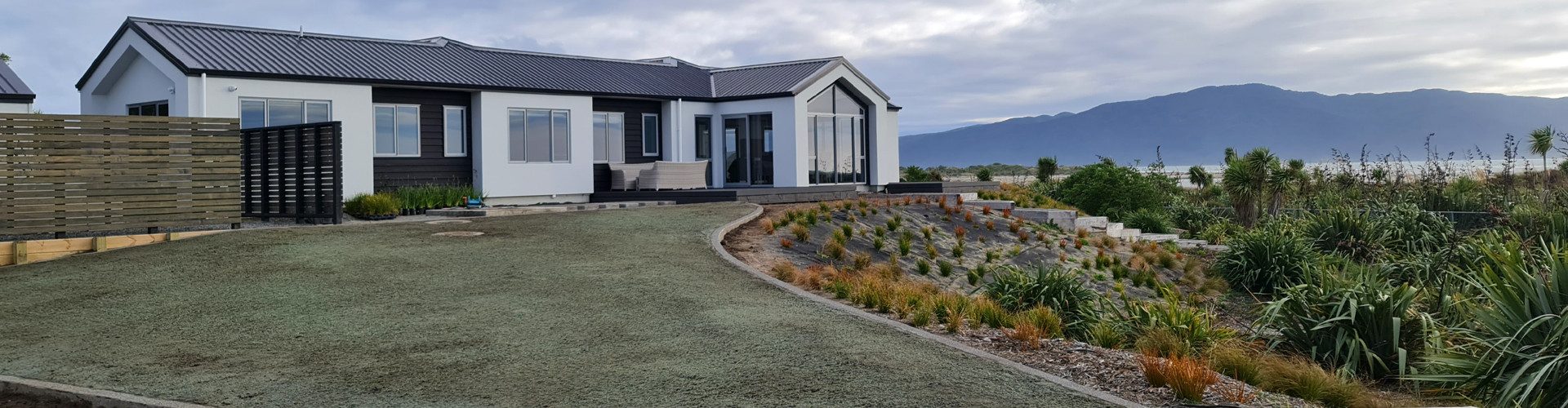 New home with landscaped surrounds and driveway