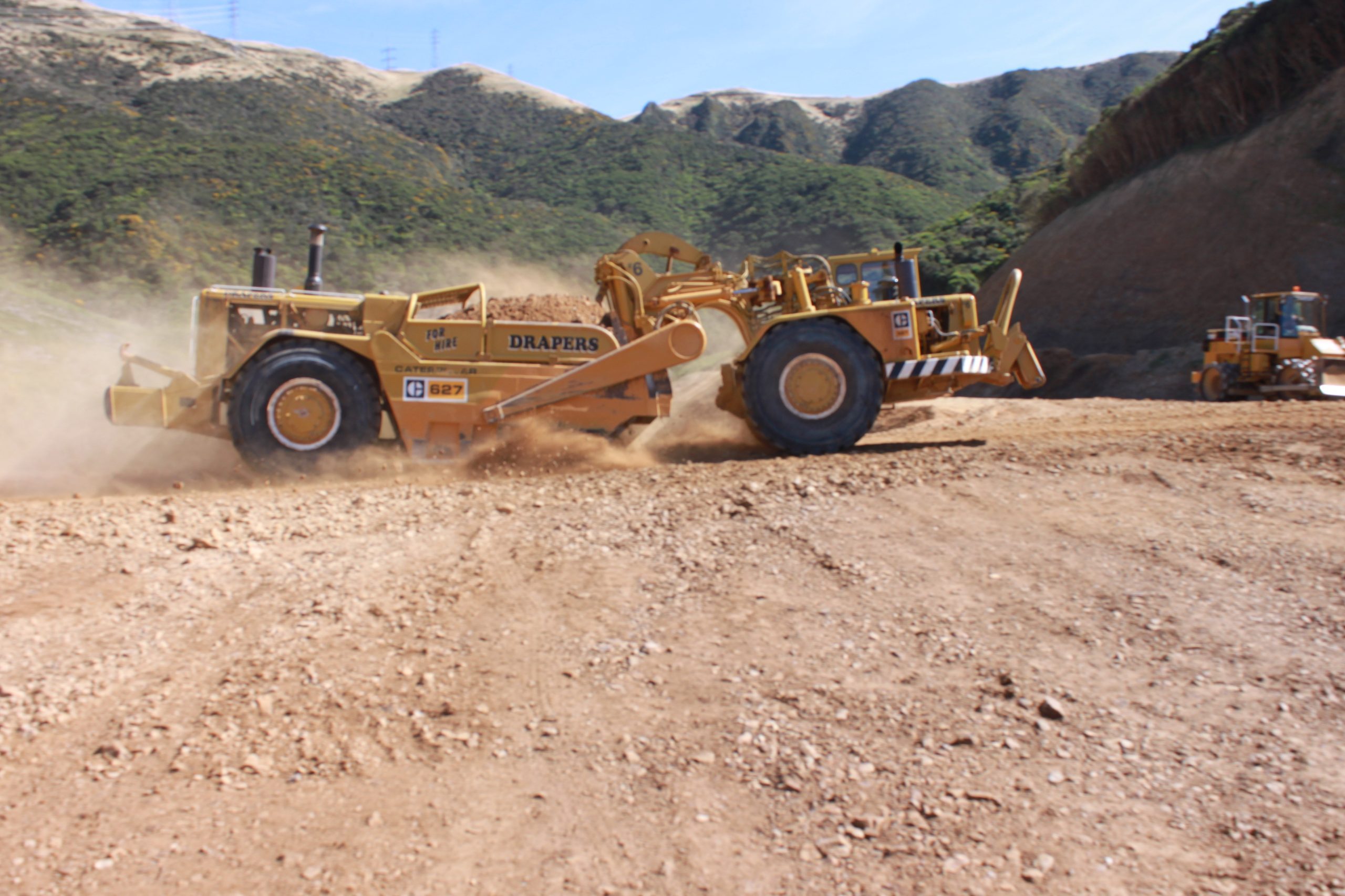 Scraper shaping ground on a subdivision earthworks site